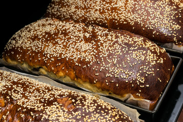 fresh baked sweet bread covered with sesame seeds