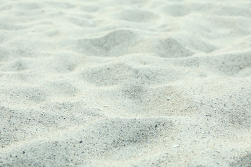 Sea ​​sand as background, space for text, closeup. Summer backdrop