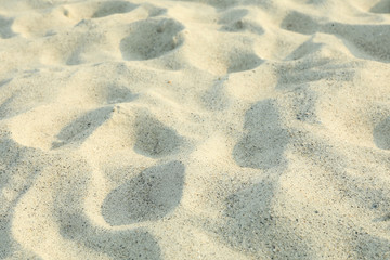 Sea ​​sand as background, space for text, closeup. Summer backdrop