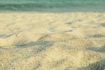 Fototapeta na wymiar Sea sand as background, space for text. Summer backdrop