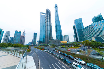 The pedestrian pavement under the tall building large building.