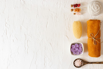 Top view of spa set with towels flower, Luffa, Mortar and stone. Relaxation concept