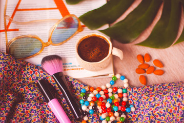 Relaxing morning time with cup of coffe and magazine. Closeup, woman lifestyle.