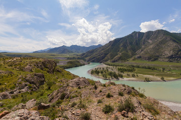 Fototapeta premium Panoramic view of an Altai mountain Katun river. Place of confluence of Katun and Chuya rivers. Summer time.