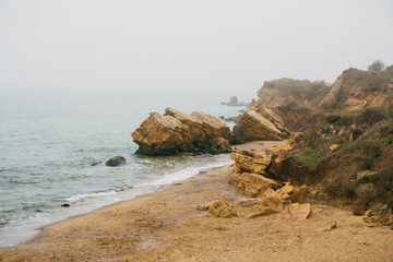 Beautiful wild Beach Fontanka near Odessa. Yellow and red sandstone cliffs are located on the seafront