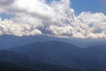Fototapeta premium Clouds in the evening sunset in mountain.