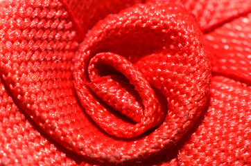 carpet made of soft material, shaped like a collection of woven strands of yarn