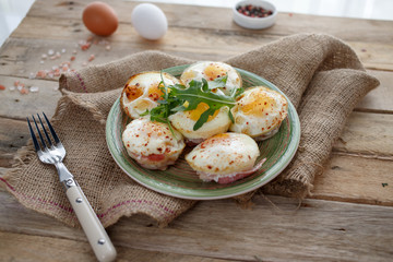 Homemade appetizers with mushroom, eggs, and bacon
