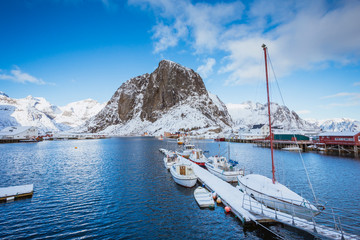 Beautiful pier in the sea in winter, good sunny weather, high mountains