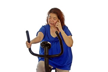 Fat women wear a blue shirt are exercising by cycling, isolated on white background.