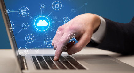 Businessman hand typing with cloud technology system and office symbol concept
