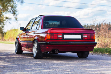 The rear of the old, red, German car - obrazy, fototapety, plakaty