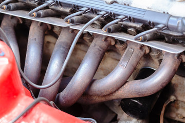 Close-up photo of An exhaust manifold - obrazy, fototapety, plakaty