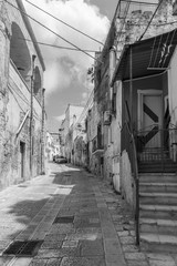 Massafra and its ravines. Houses built in the rock. Puglia in Black and White. Italy