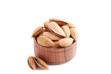 Group of almonds in bowl isolated on white background