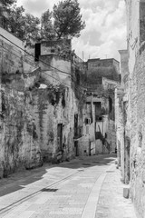 Massafra and its ravines. Houses built in the rock. Puglia in Black and White. Italy