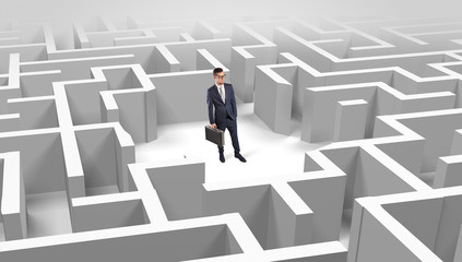 Young businessman standing in a middle of a 3D maze
