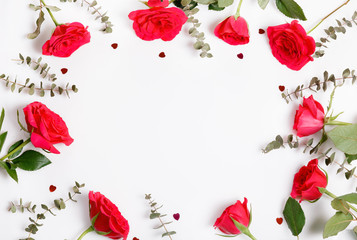 Festive red rose flower composition on the white background. Overhead view