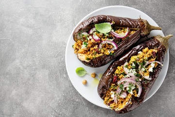 Baked aubergine with bulgur and feta