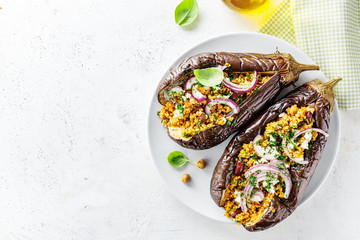 Baked aubergine with bulgur and feta