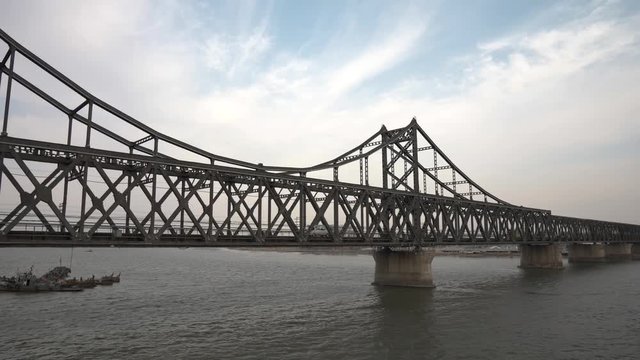Truck drives over korean chinese friendship bridge from Sinuiju DPRK to Dandong China which is under united nations embargo