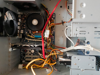 A working computer. Computer running without side cover.