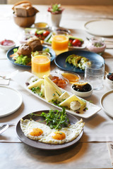 Turkish breakfast with various plates on a table - obrazy, fototapety, plakaty