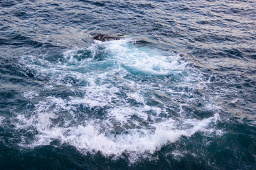 Sea waves with foam top view