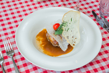 Stuffed quail in a plate according to an Italian recipe