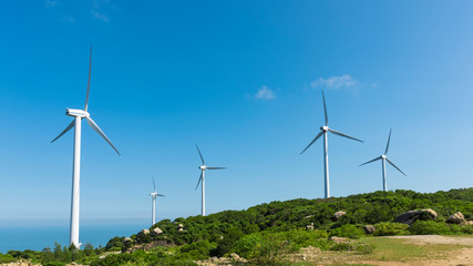 Wind turbines in the mountains near the sea