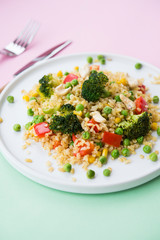 Vegetarian food. Bulgur with vegetables, broccoli, paprika and nuts. Healthy food.