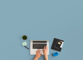 Man working on laptop. Top view on workspace with copy space.