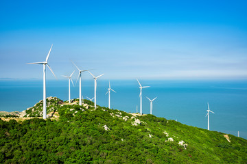 Wind turbines in the mountains near the sea