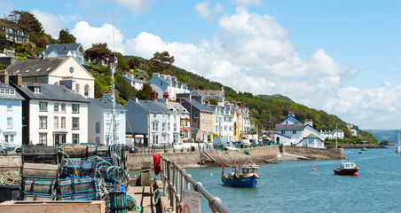 Welsh town of Aberdyfi taken from pier with crab nest in the foreground and boats in estuary - obrazy, fototapety, plakaty