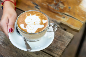 cat cartoon on coffee latte art