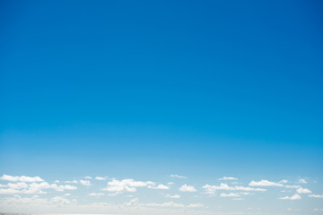 Clear blue sky with few clouds