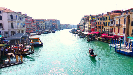 Venice, Italy. April 10, 2019 - Wide water canal in Venezia with a single godolier in a boat