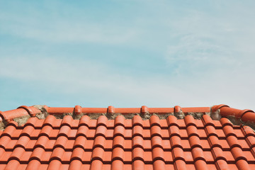 tile roof on the background of the bare sky. copy space for your text