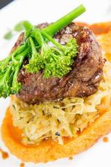 Beef sirloin with sweet potato mousse, curry sauerkraut and fresh thyme sauce