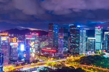 Fototapeta na wymiar Tall buildings and traffic roads in downtown shenzhen at night.