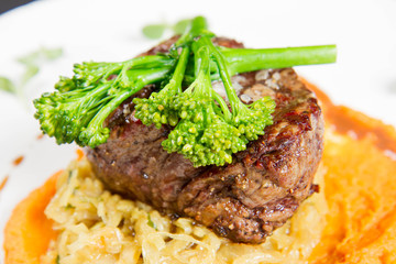 Beef sirloin with sweet potato mousse, curry sauerkraut and fresh thyme sauce