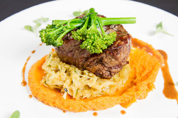 Beef sirloin with sweet potato mousse, curry sauerkraut and fresh thyme sauce