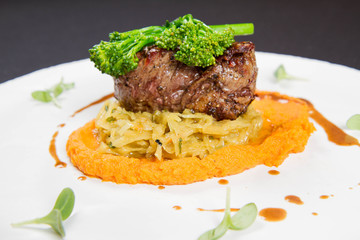 Beef sirloin with sweet potato mousse, curry sauerkraut and fresh thyme sauce