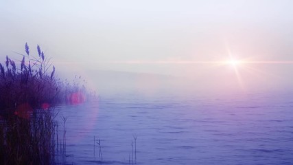 Foggy morning at moody sea with cloudy sky and gloomy sun