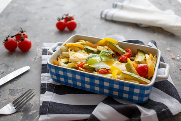 Breakfast with baked vegetables and egg. Homemade