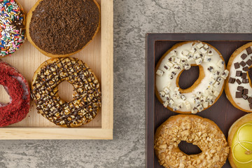 bakery food background of assortment of donut in tray on table