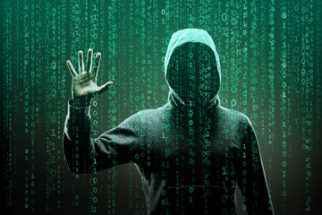 Computer hacker in mask and hoodie over abstract binary background. Obscured dark face. Data thief,...