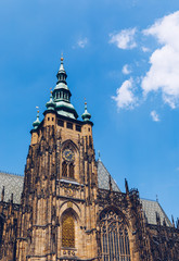 Fototapeta premium Prague, bell gothic towers and St. Vitus Cathedral. St. Vitus is a Roman Catholic cathedral in Prague, Czech Republic. Panoramic view from the courtyard to the south facade. Prague, Czechia.