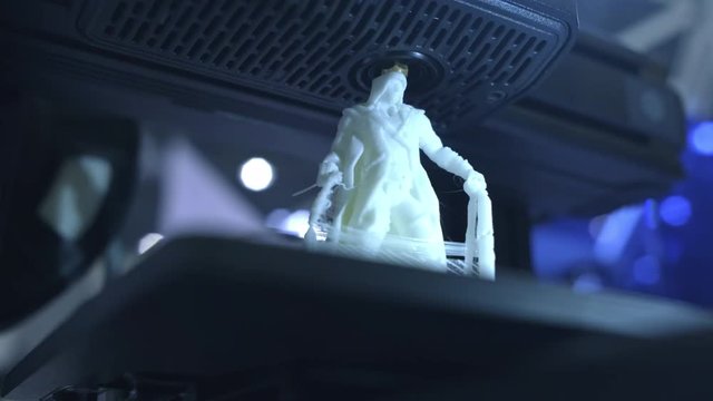 3D printer working close up. Automatic three dimensional 3d printer performs plastic. Modern 3D printer printing an object from the hot molten. Concept progressive additive technology for 3d printing