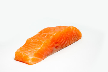 A large pink salmon fillet isolated on a white background